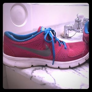 Pink and blue Nike tennis shoes